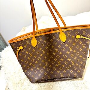 Louis Vuitton Neverfull MM tote  Almost new… just minor pen accident inside